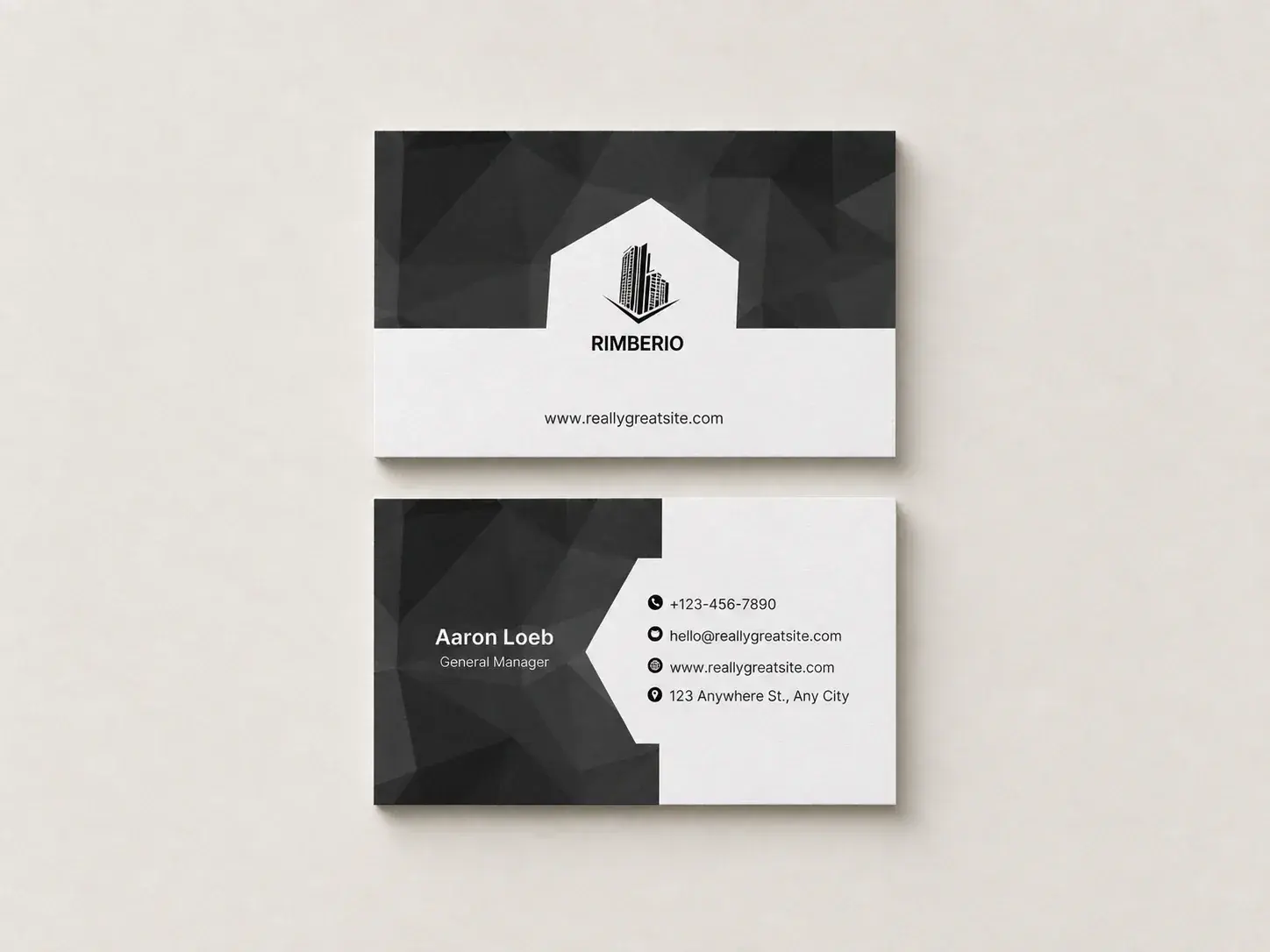 Front and back of a black and white uncoated business card, laid flat