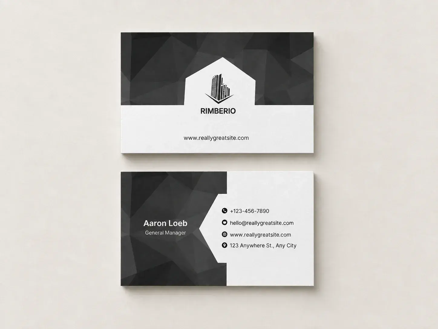Front and back of a black and white uncoated business card, laid flat