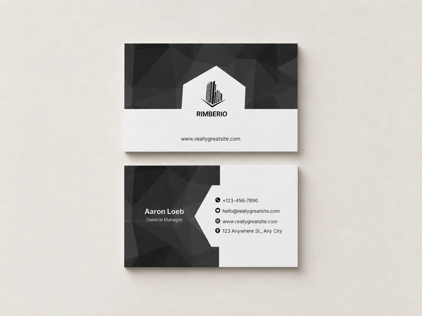 Front and back of a black and white uncoated business card, laid flat