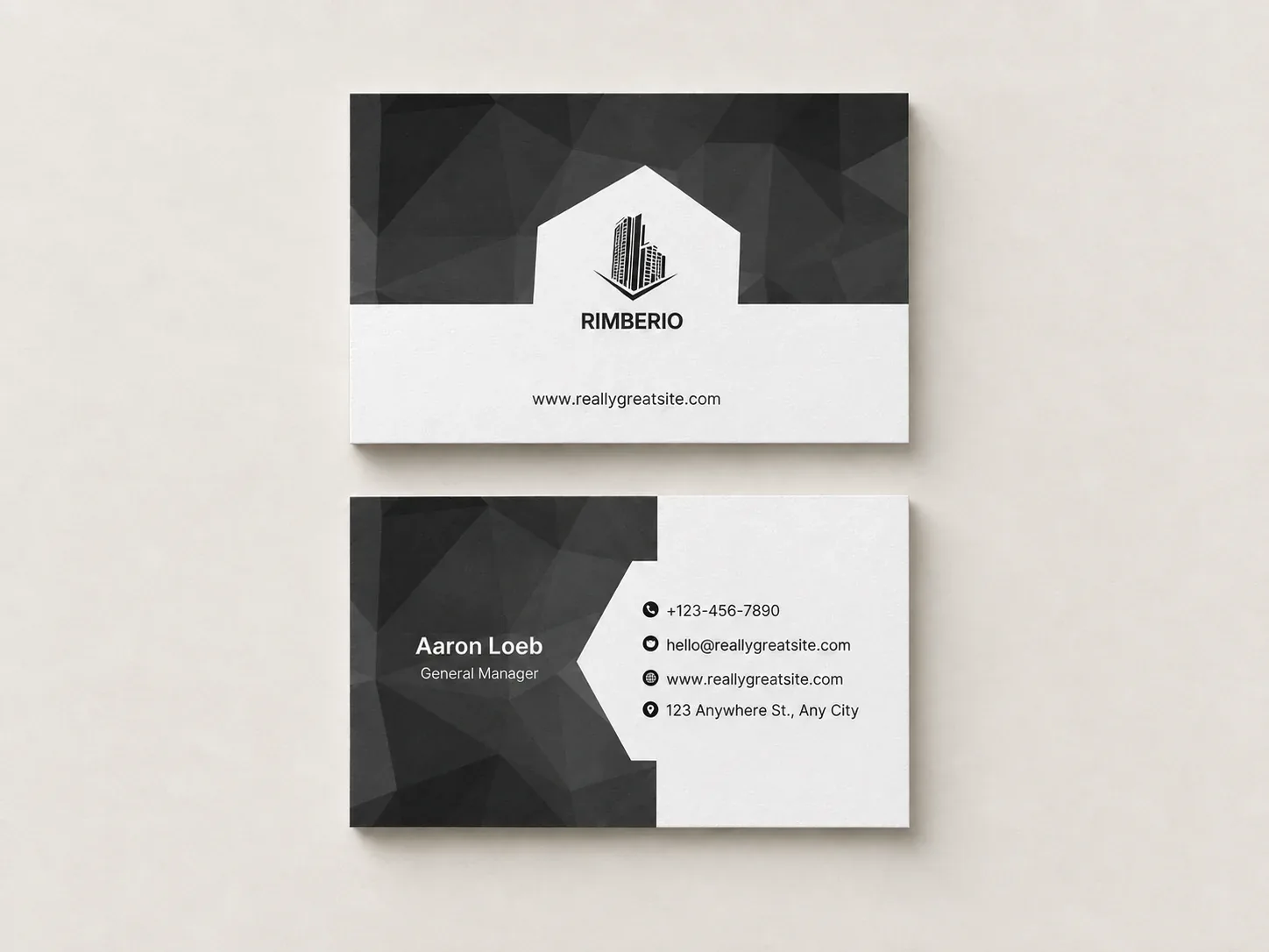 Front and back of a black and white uncoated business card, laid flat
