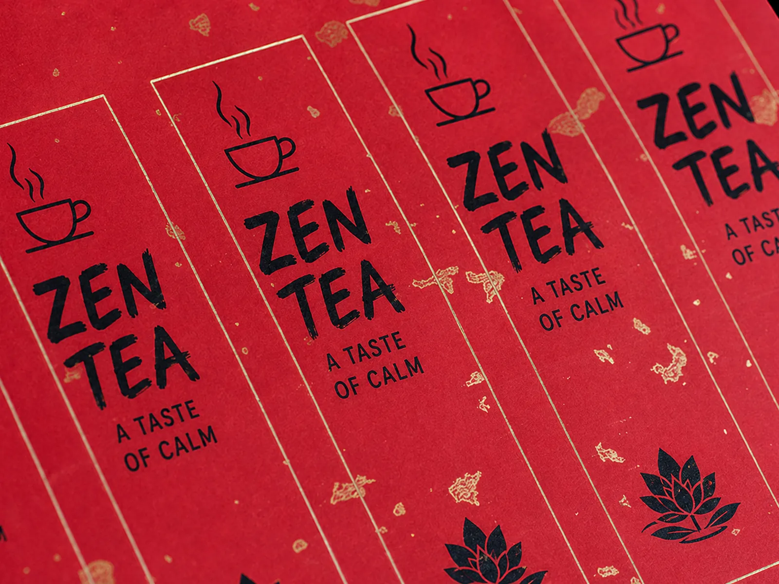 A sheet of tall tea labels on red paper with scattered gold flakes